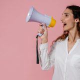 woman speaking on a megaphone